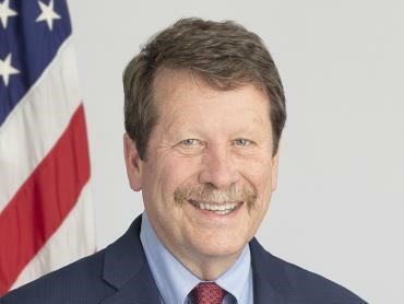 A headshot of Robert Califf