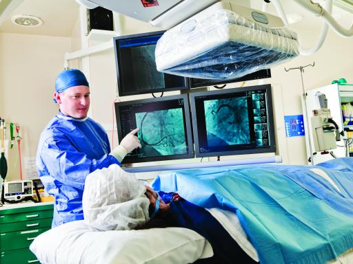 Doctor speaking to patient on table