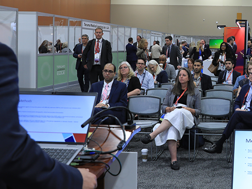 A photo from SCAI Scientific Sessions 2023 of a room of doctors listening to a speaker.